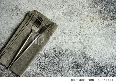 Table setting on concrete background Table setting on concrete background 89454543