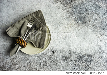 Table setting on concrete background Table setting on concrete background 89454544