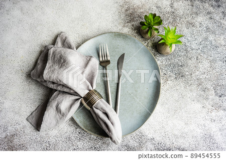 Table setting on concrete background 89454555