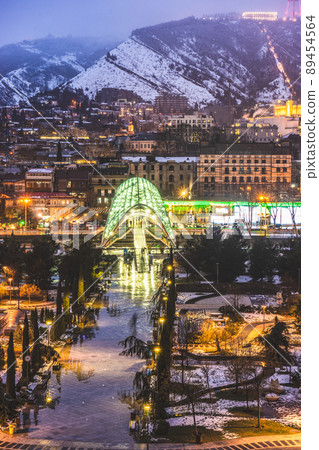 Snowing in Tbilisi city in the evening 89454564
