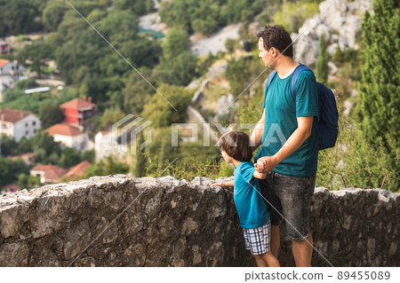 Father and son looking at the city at view point Father and son looking at the city at view point 89455089