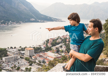 Father and son enjoy the view of Kotor Bay 89455090