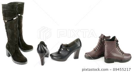 Boots, shoes and ankle boots isolated on white background. Wide photo. Boots, shoes and ankle boots isolated on white background. Wide photo. 89455217