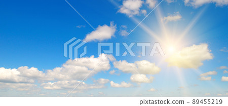 Blue sky , sun and beautiful white clouds. Wide photo. Blue sky , sun and beautiful white clouds. Wide photo. 89455219