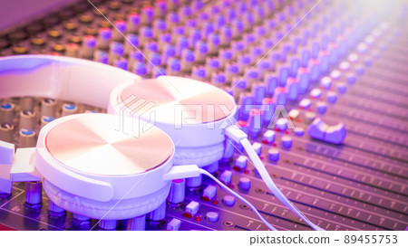 white headphone on audio mixing console. recording, broadcasting concept 89455753