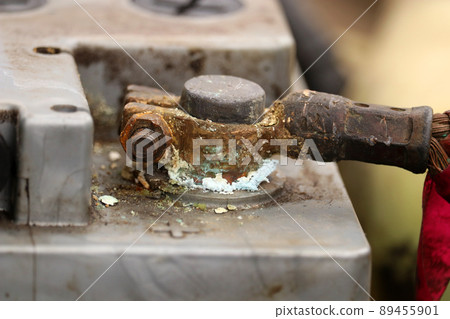 Car battery terminal covered with oxide. Car repair. Battery replacement. Car battery terminal covered with oxide. Car repair. Battery replacement. 89455901