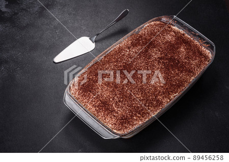 Delicious fresh tiramisu cake in a glass rectangular shape 89456258