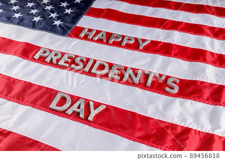 words happy presitdents day laid with real letters on US flag surface words happy presitdents day laid with real letters on US flag surface 89456818