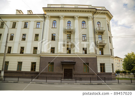 Part of a building facade with the surface of granite wall. Natural stone materials. 89457020