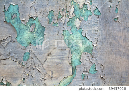 Old cracked abstract grunge vintage texture copy space background, retro pattern. White irregular spots paint peeling of light blue concrete or wooden wall or ceiling flat surface. Old cracked abstract grunge vintage texture copy space background, retro pattern. White irregular spots paint peeling of light blue concrete or wooden wall or ceiling flat surface. 89457026