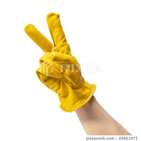 Men's hands wearing yellow leather gloves 89461971