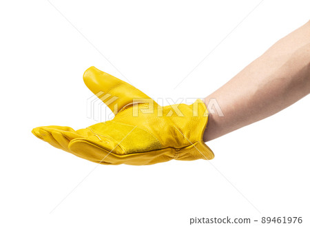 Men's hands wearing yellow leather gloves 89461976