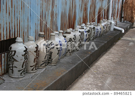 Old sake bottles lined up Old sake bottles lined up 89465821