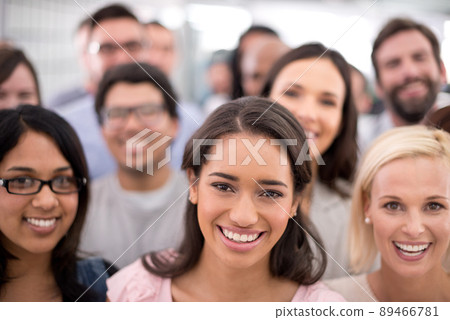 Putting on their friendliest business faces. Cropped shot of a group of smiling businesspeople. Putting on their friendliest business faces. Cropped shot of a group of smiling businesspeople. 89466781