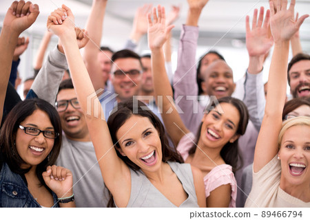 End of year party Woohoo. Shot of a group of smiling businesspeople raising their hands. End of year party Woohoo. Shot of a group of smiling businesspeople raising their hands. 89466794