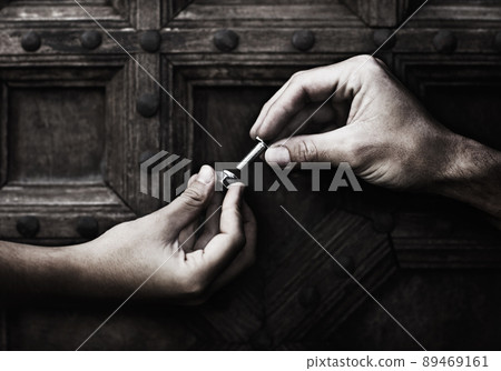 Doing a little DIY. Two hands screwing together a nut and bolt. 89469161