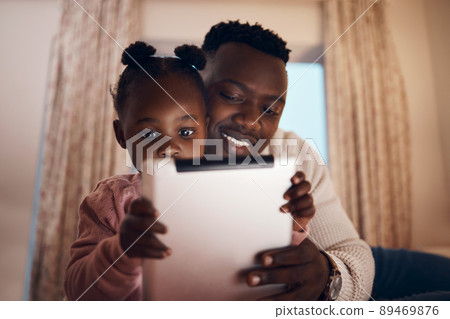 Which one is a your favourite. Shot of a father reading his daughter bedtime stories. Which one is a your favourite. Shot of a father reading his daughter bedtime stories. 89469876