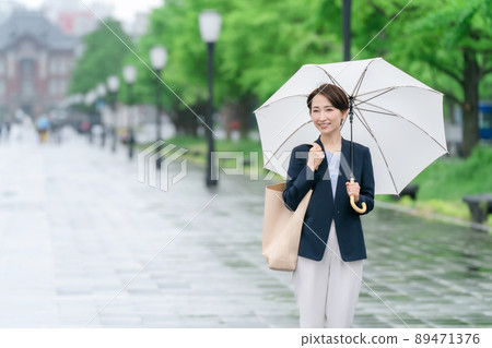 Business woman rain umbrella rainy season 89471376