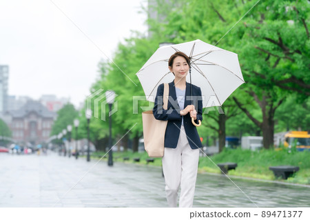 Business woman rain umbrella rainy season Business woman rain umbrella rainy season 89471377