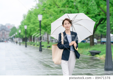 Business woman rain umbrella rainy season 89471378