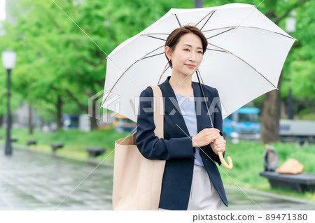 Business woman rain umbrella rainy season Business woman rain umbrella rainy season 89471380