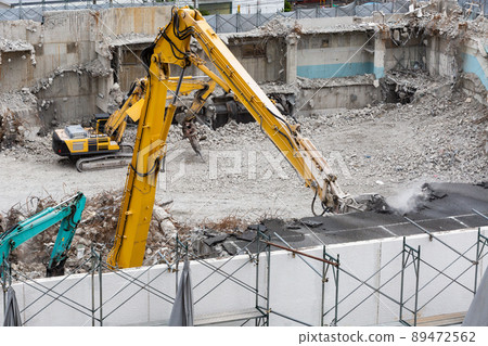 Building demolition work site by power shovel 89472562