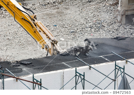 Building demolition work site by power shovel 89472563