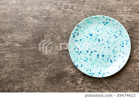 Top view of empty blue plate on cement background. Empty space for your design Top view of empty blue plate on cement background. Empty space for your design 89474622