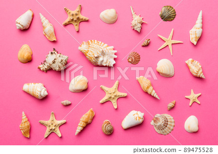 Summer time concept Flat lay composition with beautiful starfish and sea shells on colored table, top view 89475528