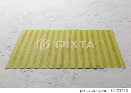 Perspective view of green tablecloth for food on cement background. Empty space for your design Perspective view of green tablecloth for food on cement background. Empty space for your design 89475720