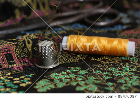 Yellow Thread and Thimble on Vintage Chinese Black Silk 89476087