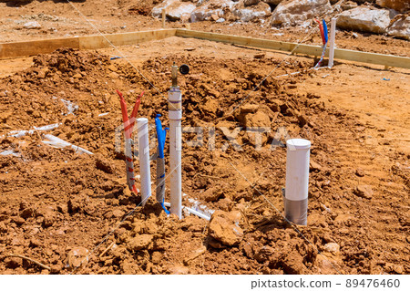 Plumbing laying line for sanitary system water PVC plastic pipes at construction site 89476460