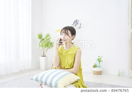 Female smartphone calling living room 89476765