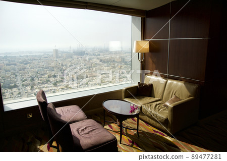 DUBAI, UNITED ARAB EMIRATES - JUN 16, 2019: Empty chairs in a business hotel lounge in an upper floor 89477281
