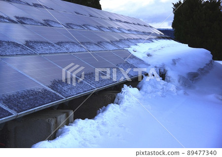 A state of the solar panel in the snowy country Frozen solar panel 89477340