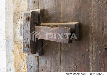 Closeup of a wooden aged latch 89478652