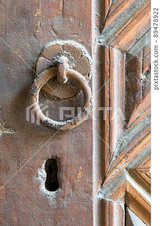 Closeup of rusted ring door knocker Closeup of rusted ring door knocker 89478922