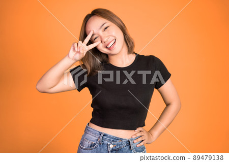 woman with peaceful hand gesture on isolated background woman with peaceful hand gesture on isolated background 89479138
