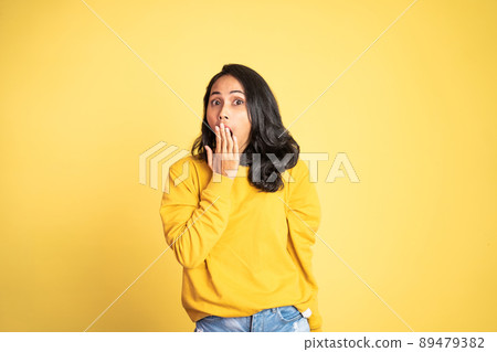 woman feeling shocked and suprised over isolated background woman feeling shocked and suprised over isolated background 89479382
