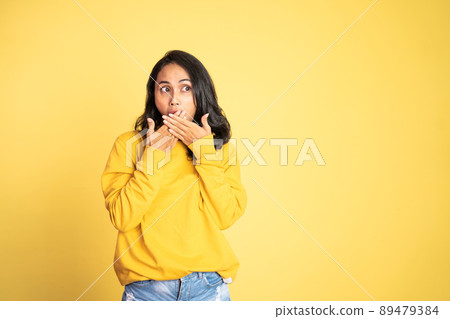 woman feeling shocked and suprised over isolated background 89479384