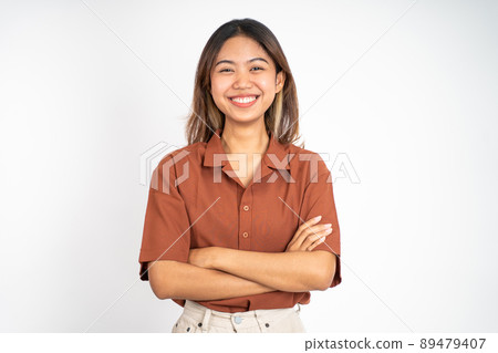 beautiful ethnic asian woman stand with crossed hands on isolated beautiful ethnic asian woman stand with crossed hands on isolated 89479407
