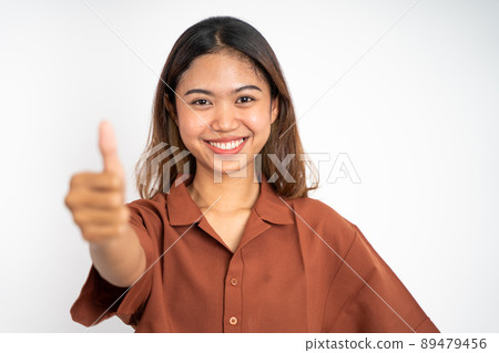 woman stand with thumbs up on isolated background woman stand with thumbs up on isolated background 89479456