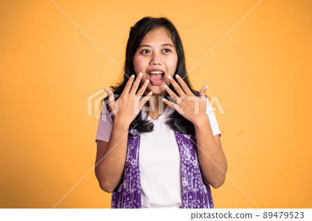 woman feeling shocked and suprised over isolated background woman feeling shocked and suprised over isolated background 89479523