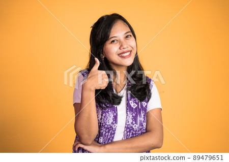 woman stand with thumbs up on isolated background woman stand with thumbs up on isolated background 89479651
