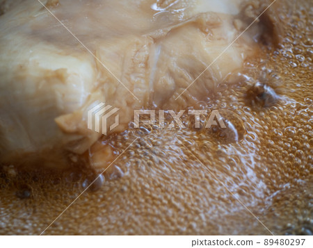 Fizzy cooking oil while frying chicken Fizzy cooking oil while frying chicken 89480297