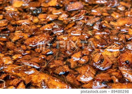 Chopped coconut husks soaked in water to prepare for use as planting material Chopped coconut husks soaked in water to prepare for use as planting material 89480298