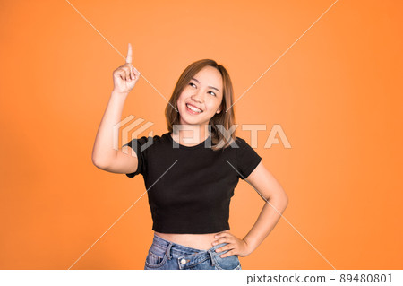 woman with finger pointing up hand gesture on isolated background 89480801