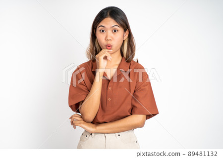 woman feeling shocked and suprised over isolated background woman feeling shocked and suprised over isolated background 89481132