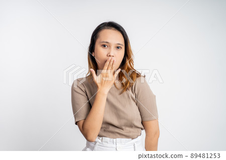 woman feeling shocked and suprised over isolated background woman feeling shocked and suprised over isolated background 89481253