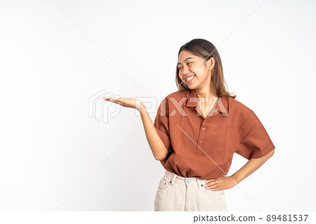 Asian girl with hand gesture presenting something on isolated Asian girl with hand gesture presenting something on isolated 89481537